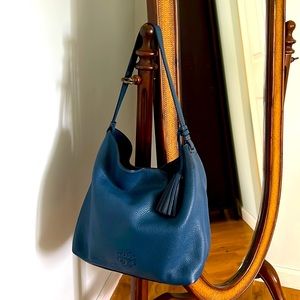Beautiful Tory Burch blue hobo style handbag. 13”wide, 11”long,7” deep.